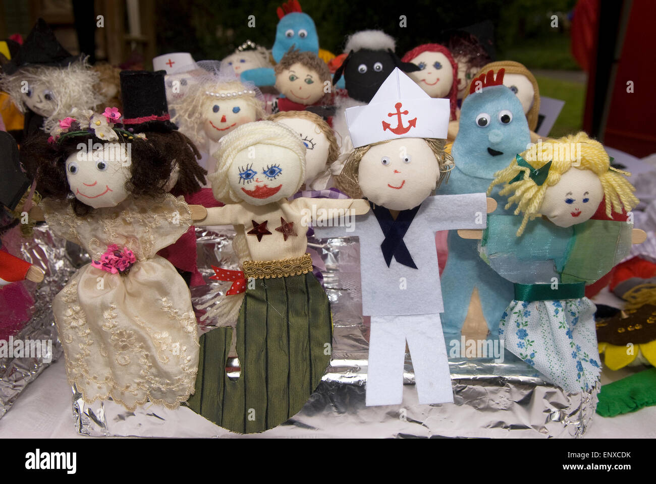 Miniature scarecrows for sale at a Scarecrow Festival, Frensham, near Farnham, Surrey, UK. Stock Photo
