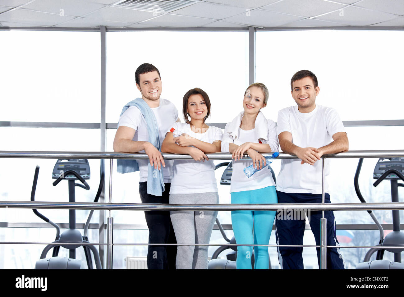 Young people in sports suits in fitness club Stock Photo