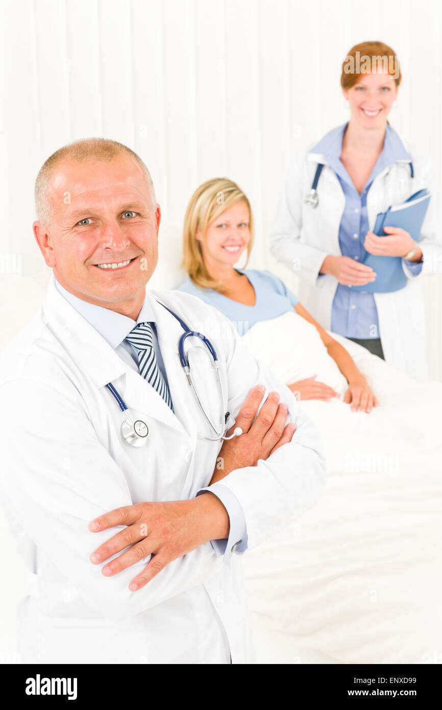 Medical doctors with hospital patient lying bed Stock Photo Alamy