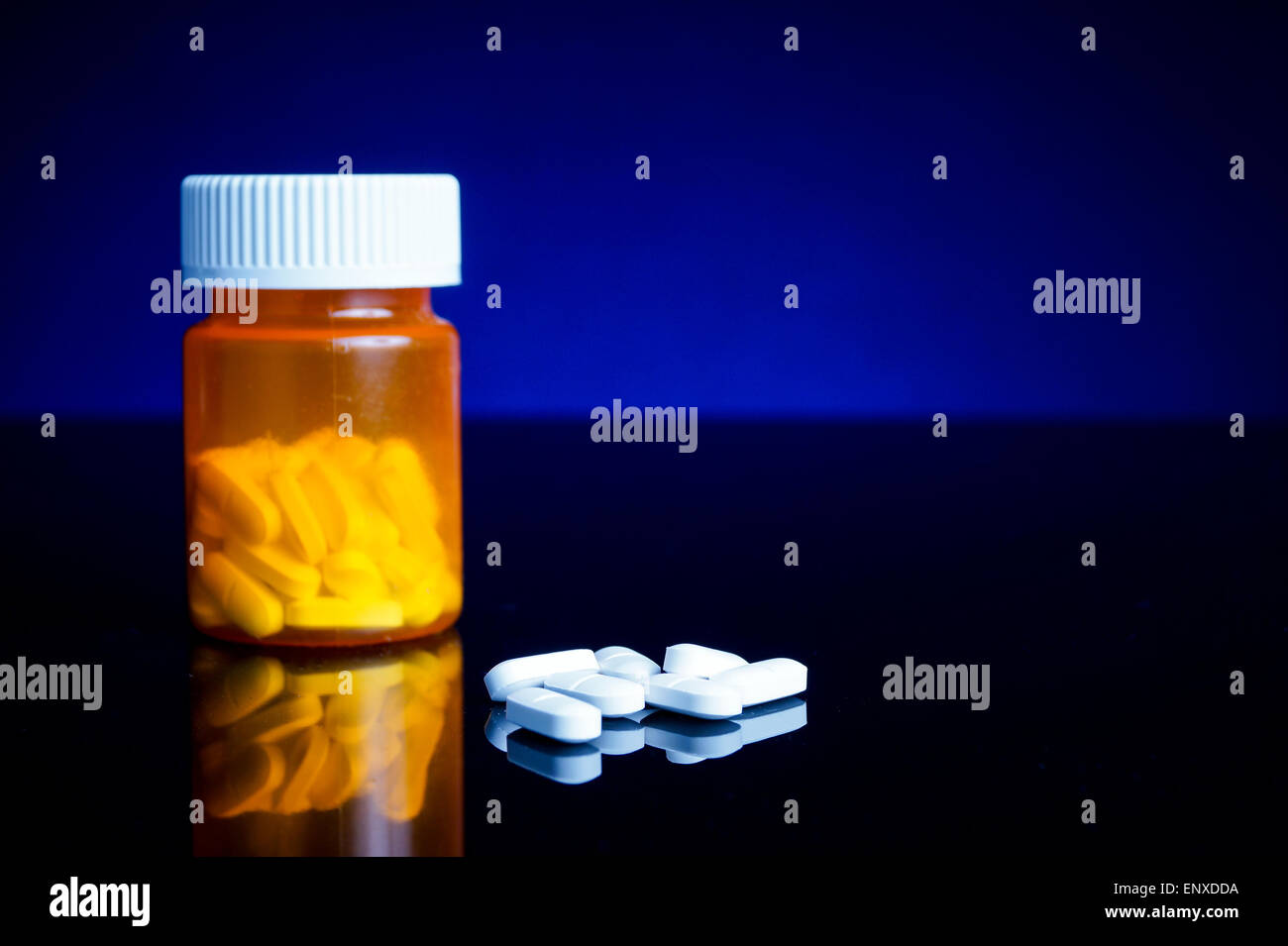 medicin, tablets and pillbottle, with blue background Stock Photo