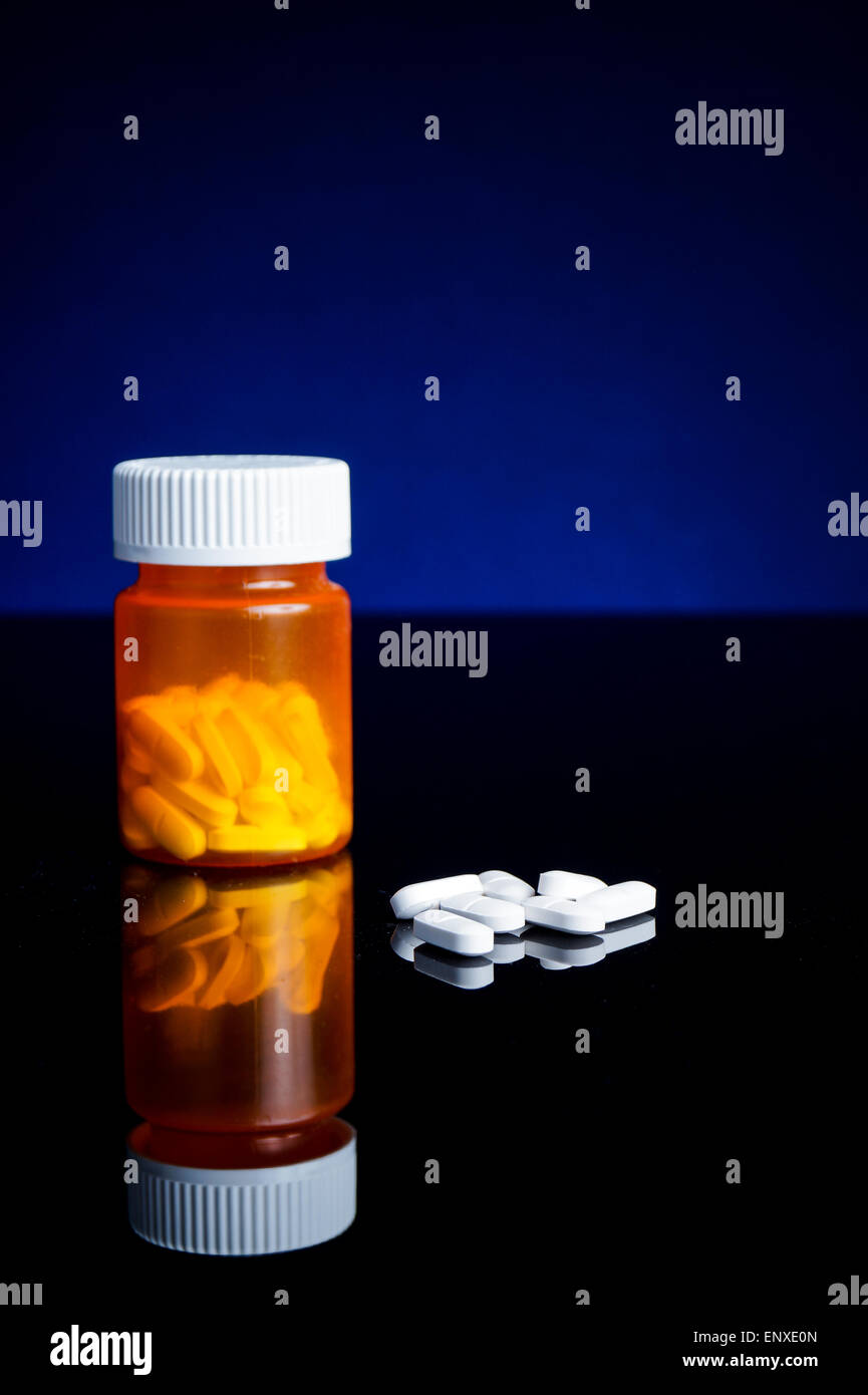 medicin, tablets and pillbottle, with blue background Stock Photo