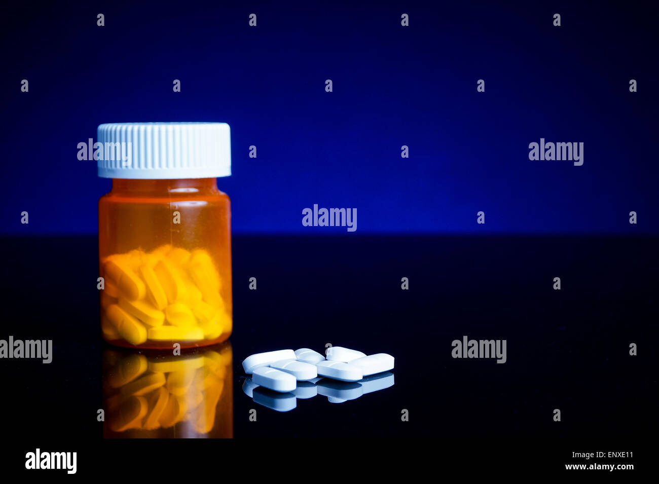 medicin, tablets and pillbottle, with blue background Stock Photo