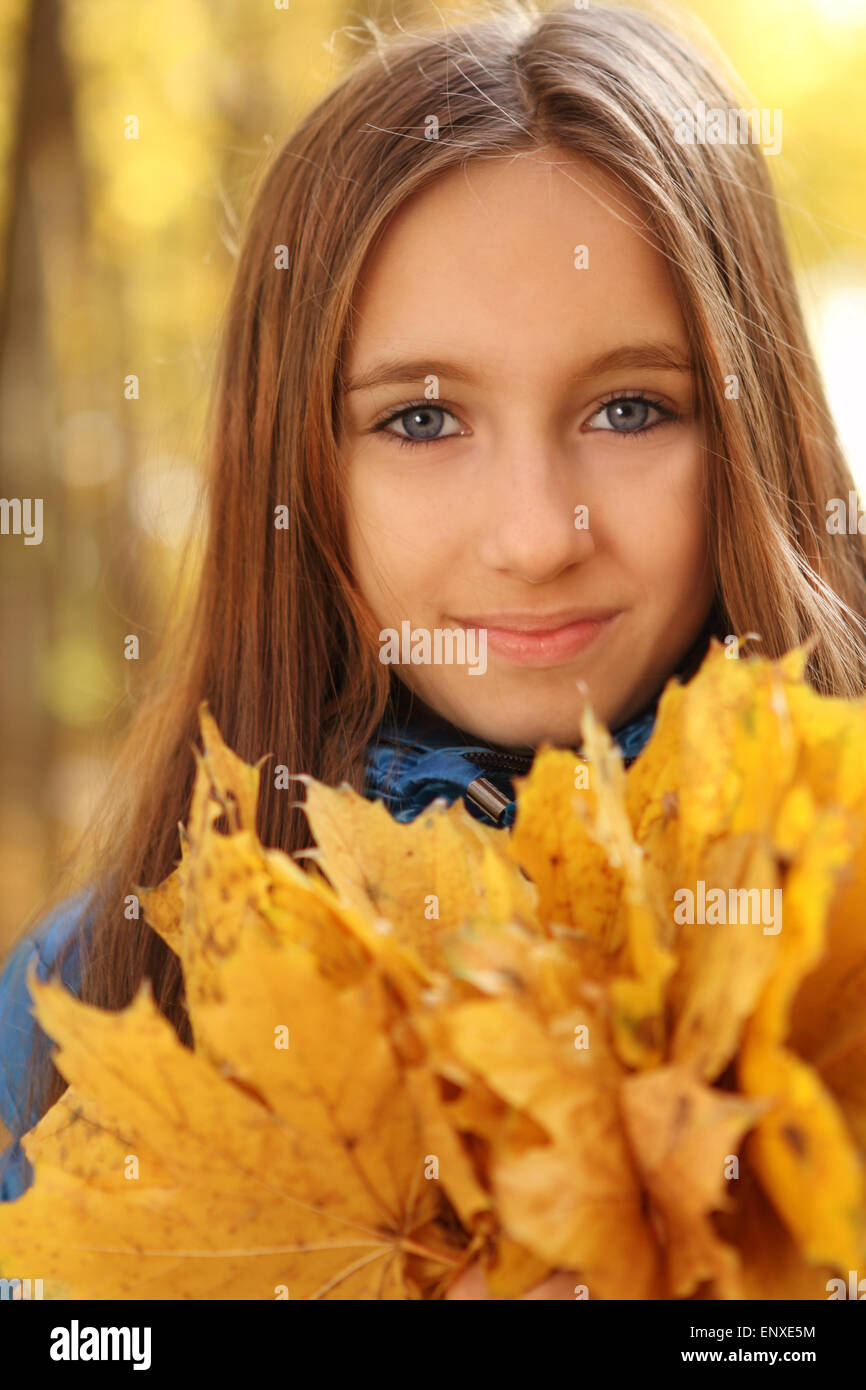 Portrait of a happy teen girl in autumn forest Stock Photo - Alamy