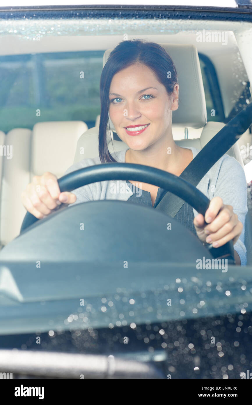 Attractive businesswoman drive luxury car smiling Stock Photo Alamy