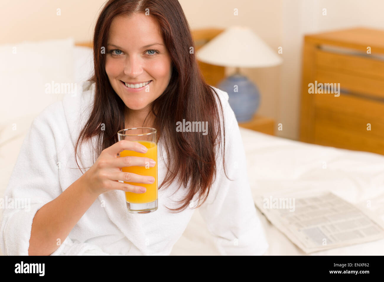 Breakfast Smiling woman with fresh orange juice Stock Photo Alamy