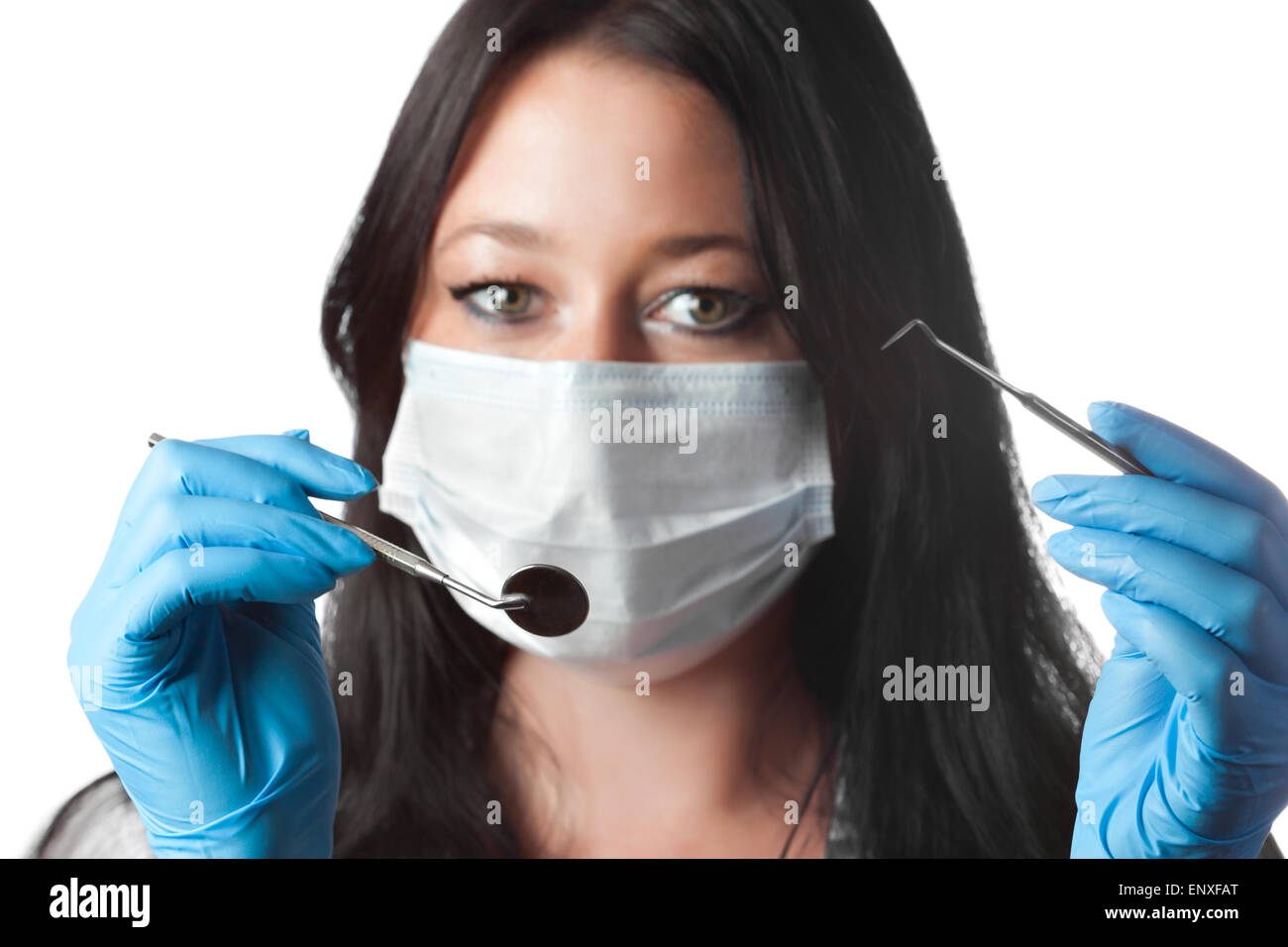 dentist in mask holding tool and mirror isolated Stock Photo