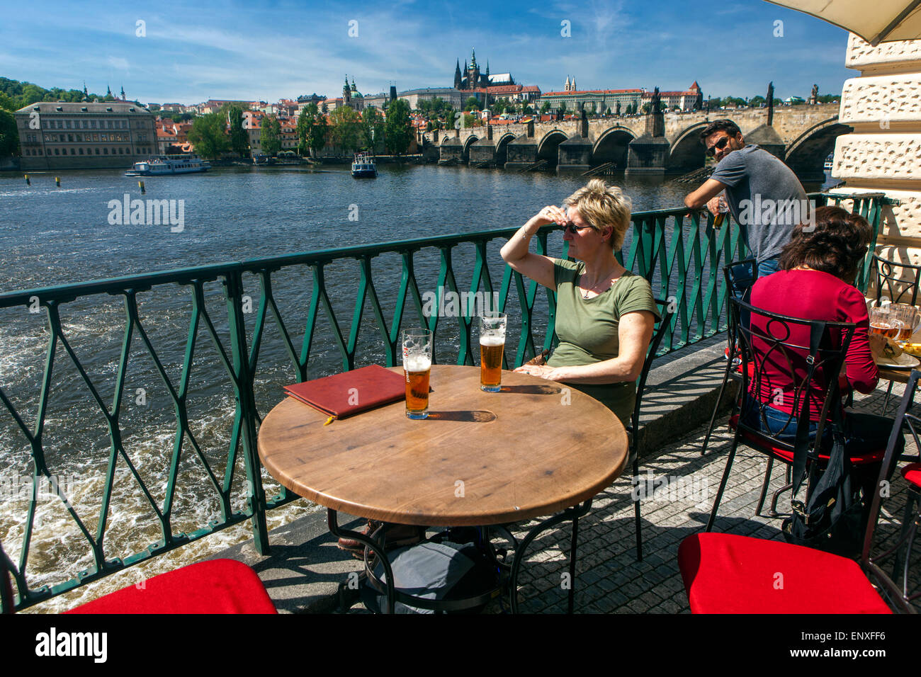 Prague restaurant people, Prague terrace with a panorama of Charles Bridge Vltava River, Summer, Prague Castle view the Czech Republic Stock Photo