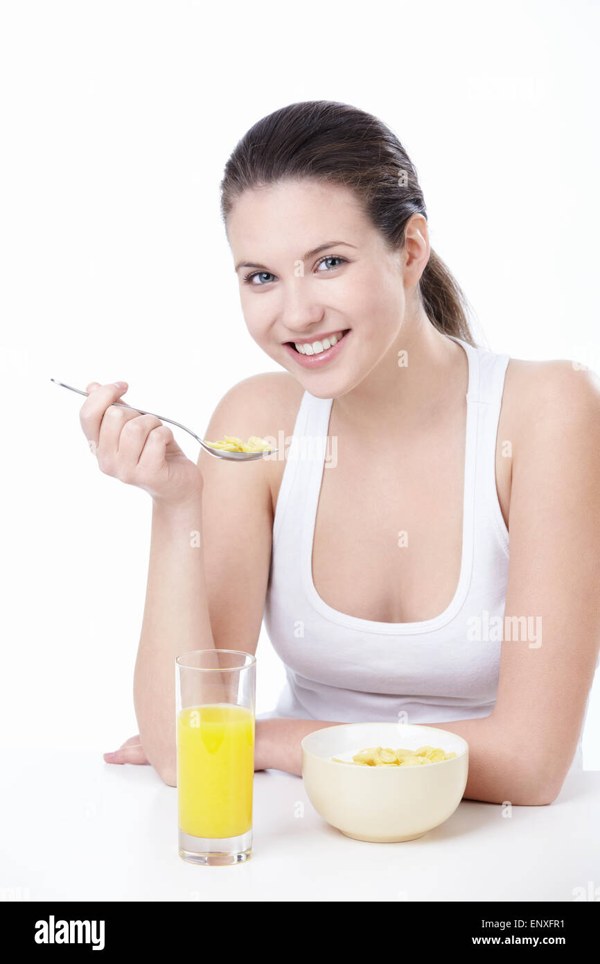 Attractive young woman lunching on white background Stock Photo