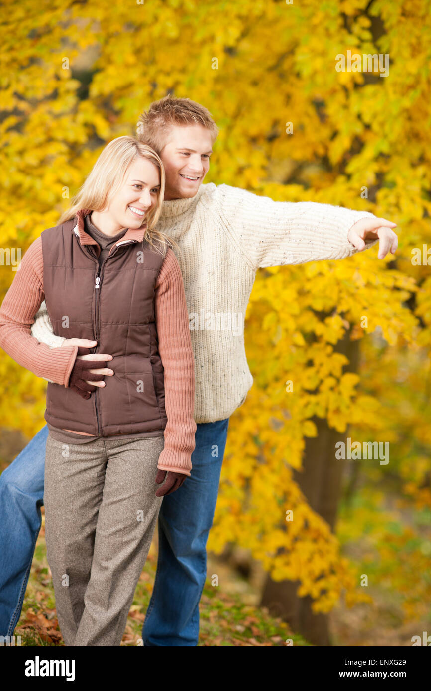 Autumn romantic couple smiling together in park Stock Photo - Alamy