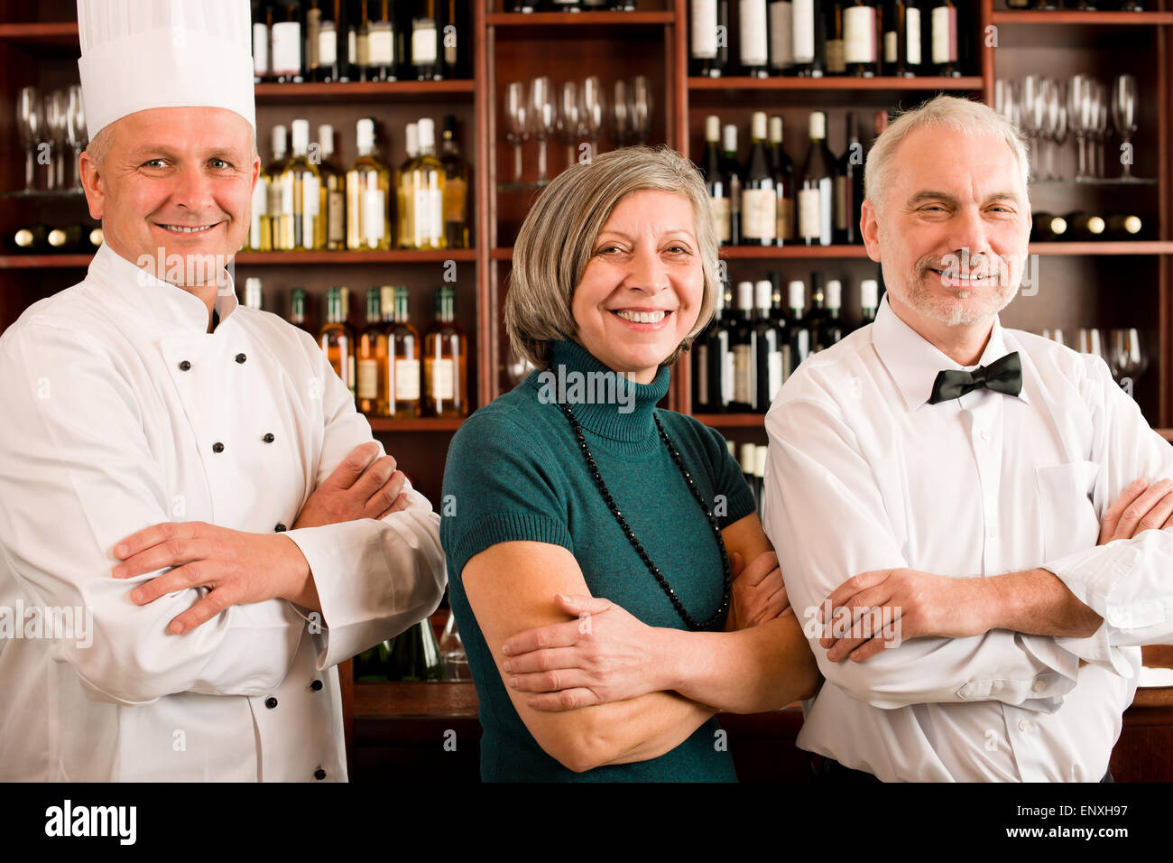 Restaurant manager posing with professional staff Stock Photo