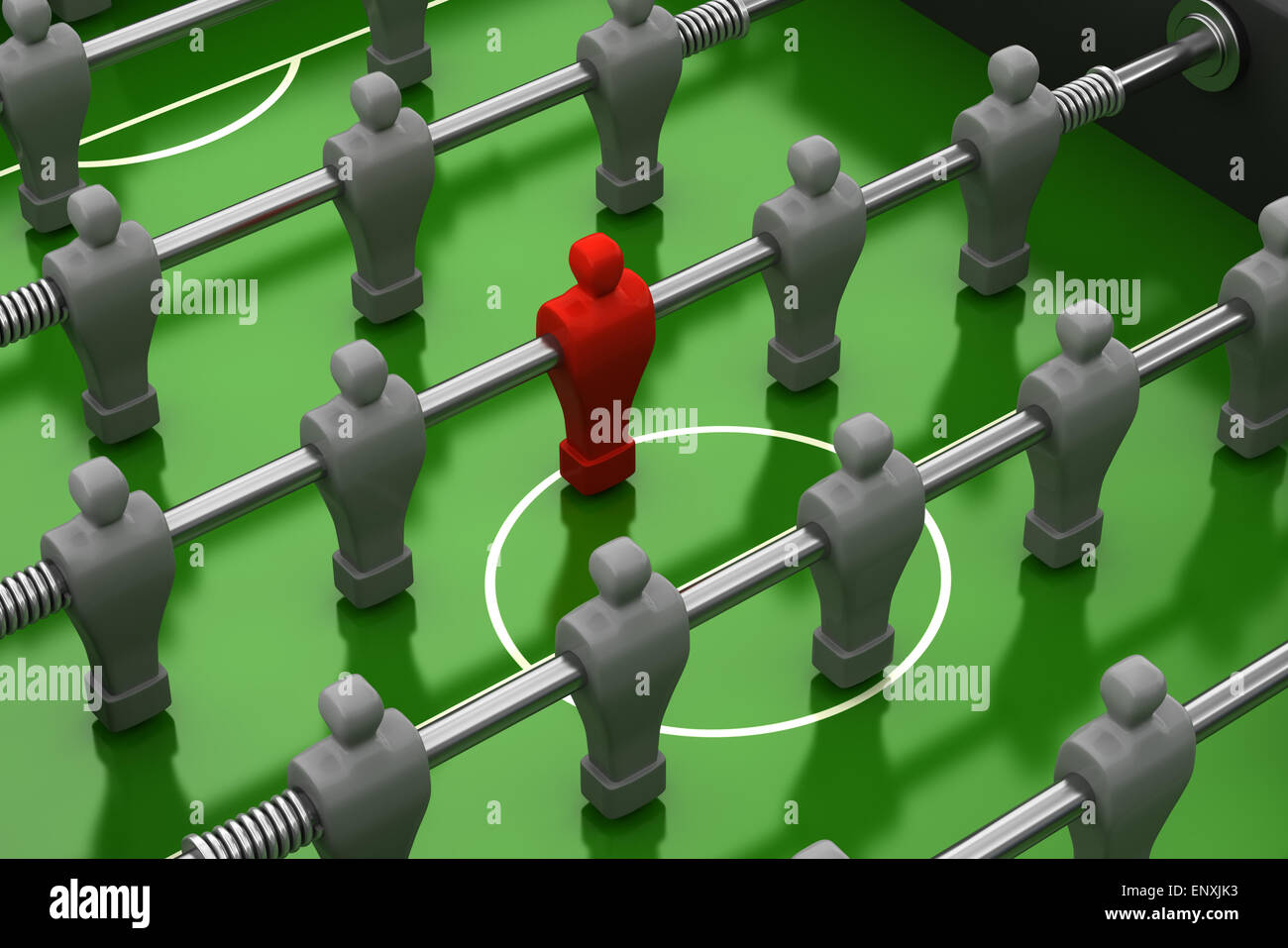 foosball table with red player among the identical Stock Photo