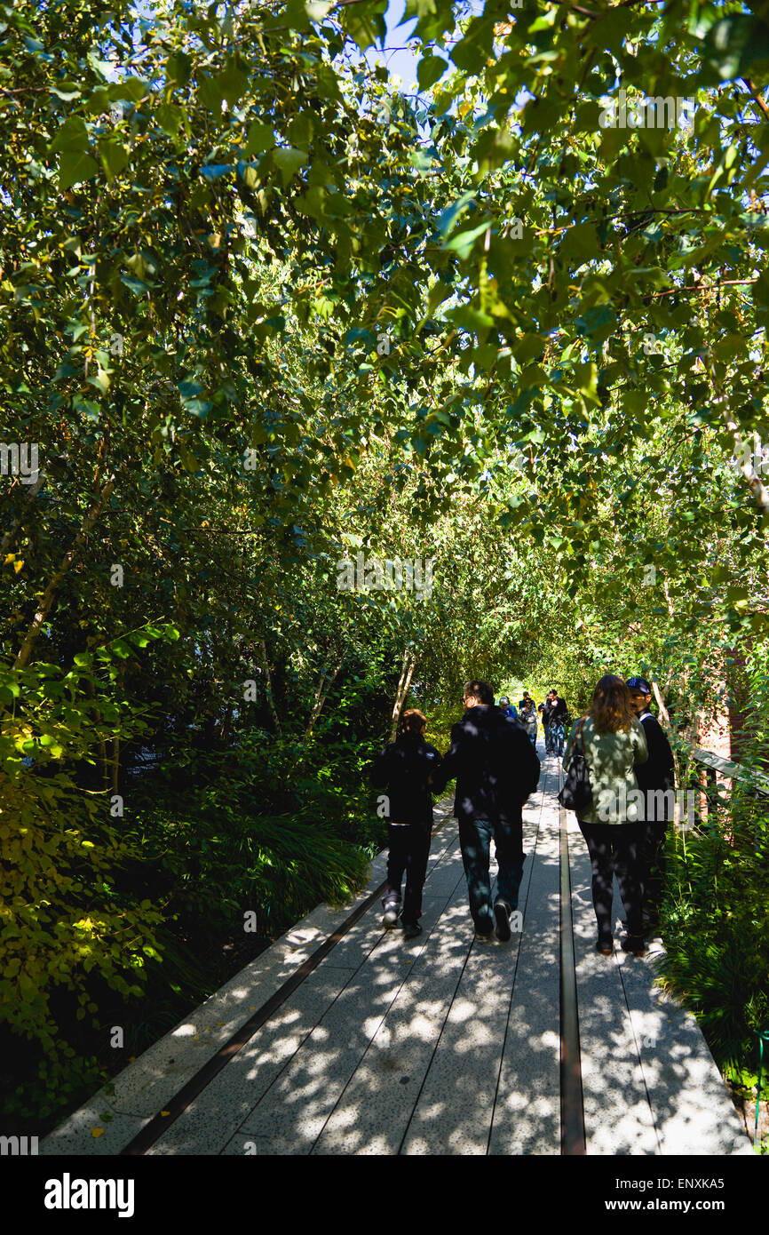 USA, New York, Manhattan, people walking under small trees in the ...