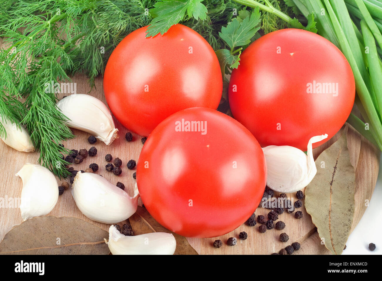 Raw vegetables on cutting board on white background Stock Photo