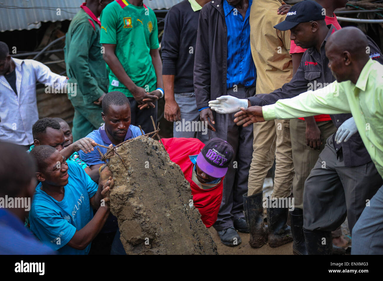 Nairobi, Kenya. 12th May, 2015. Rescuers remove debris at the site of a wall collapse accident