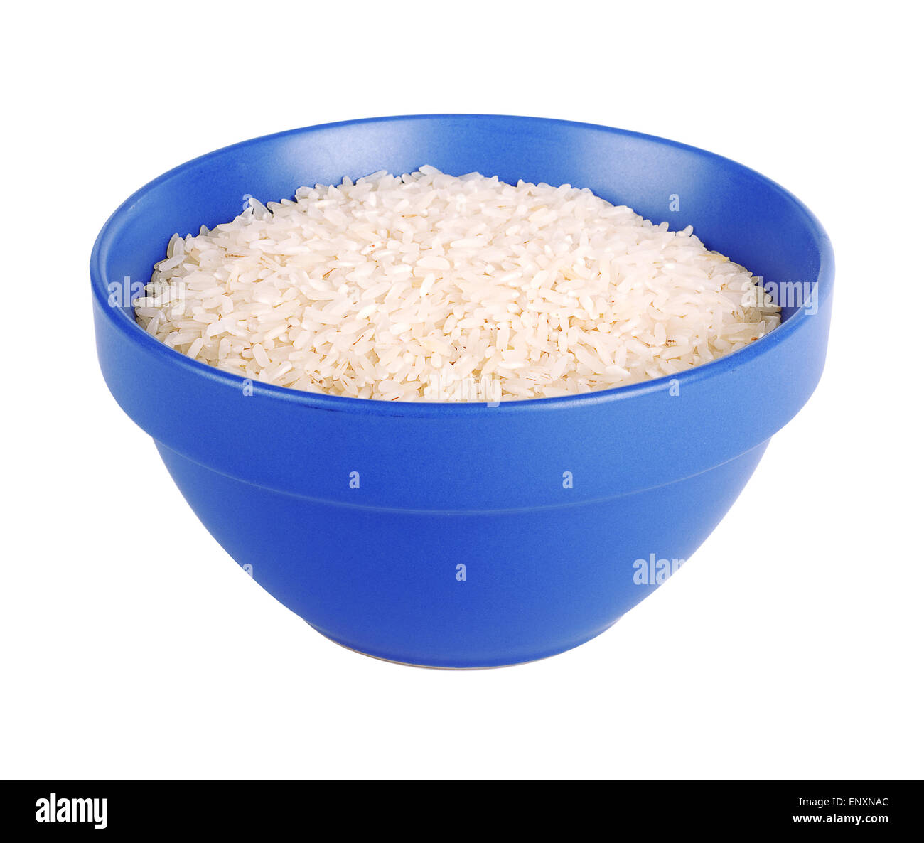 Uncooked basmati rice in a ceramic blue bowl on white isolated ...