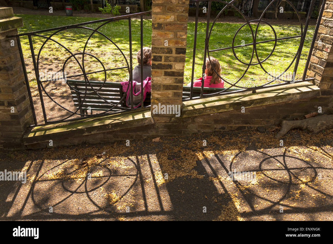 Malet Street Garden University of London UK Two women chatting talking Stock Photo