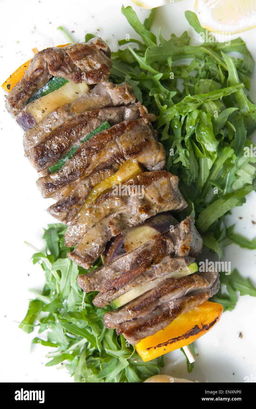 shashlik with potherbs on the plate shashlik with potherbs on the plate Stock Photo