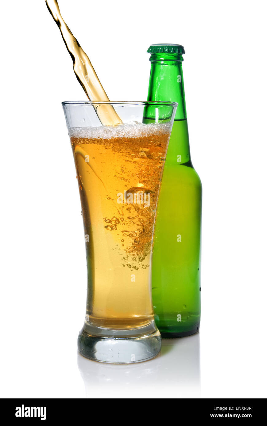 Beer pouring from into glass isolated with bottle on white Stock Photo