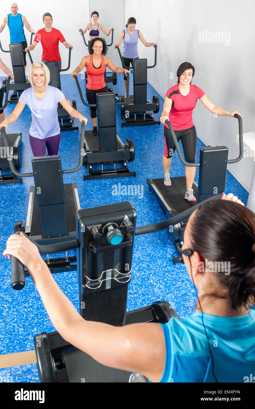 Fitness instructor leading treadmill running class Stock Photo Alamy