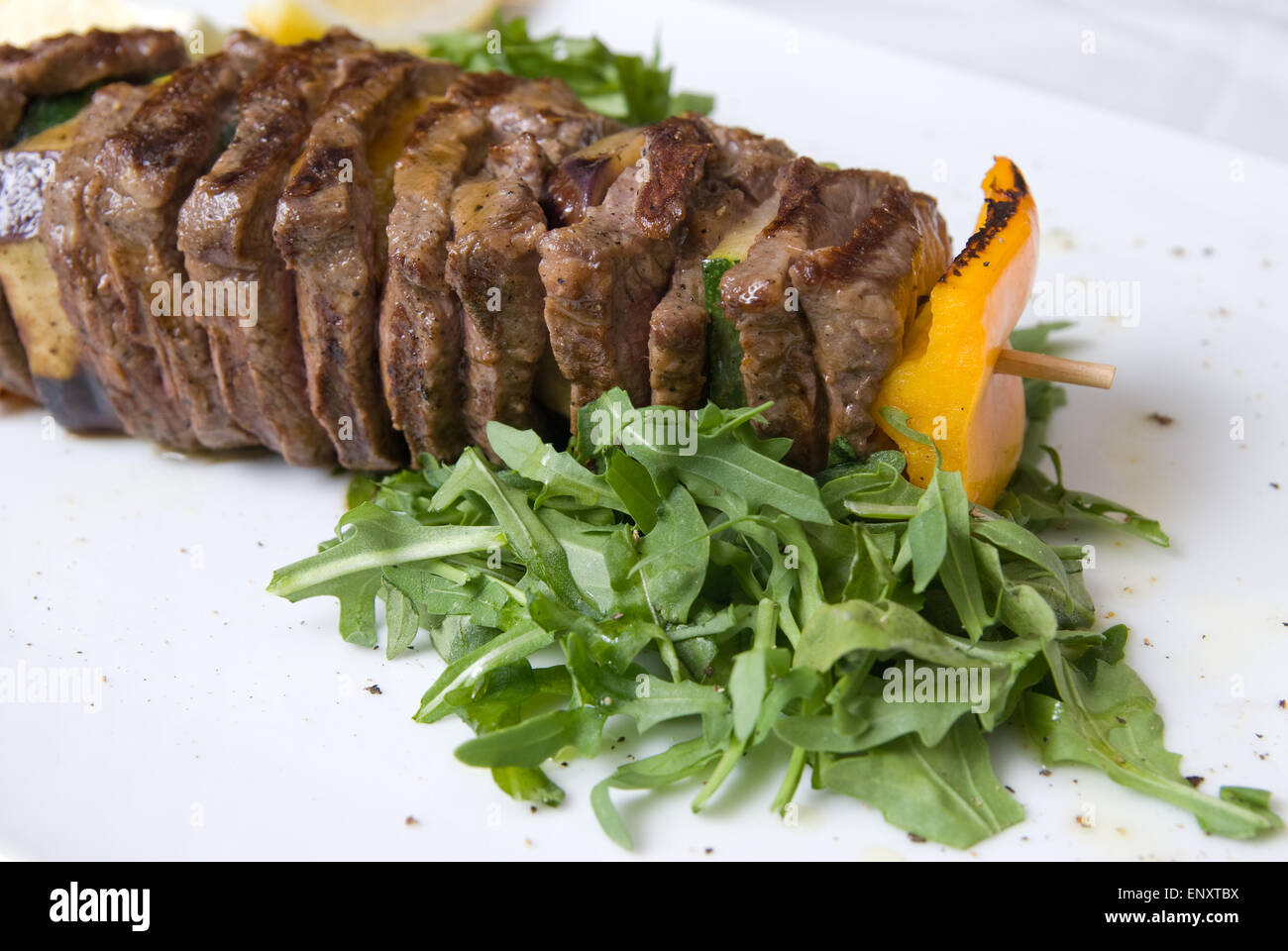 shashlik with potherbs on the plate shashlik with potherbs on the plate Stock Photo