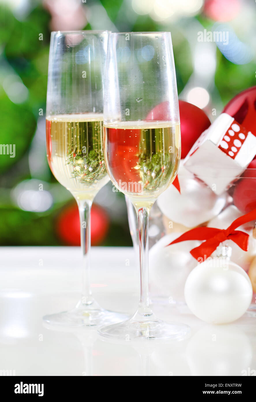 Glasses of champagne and Christmas decorations Stock Photo - Alamy