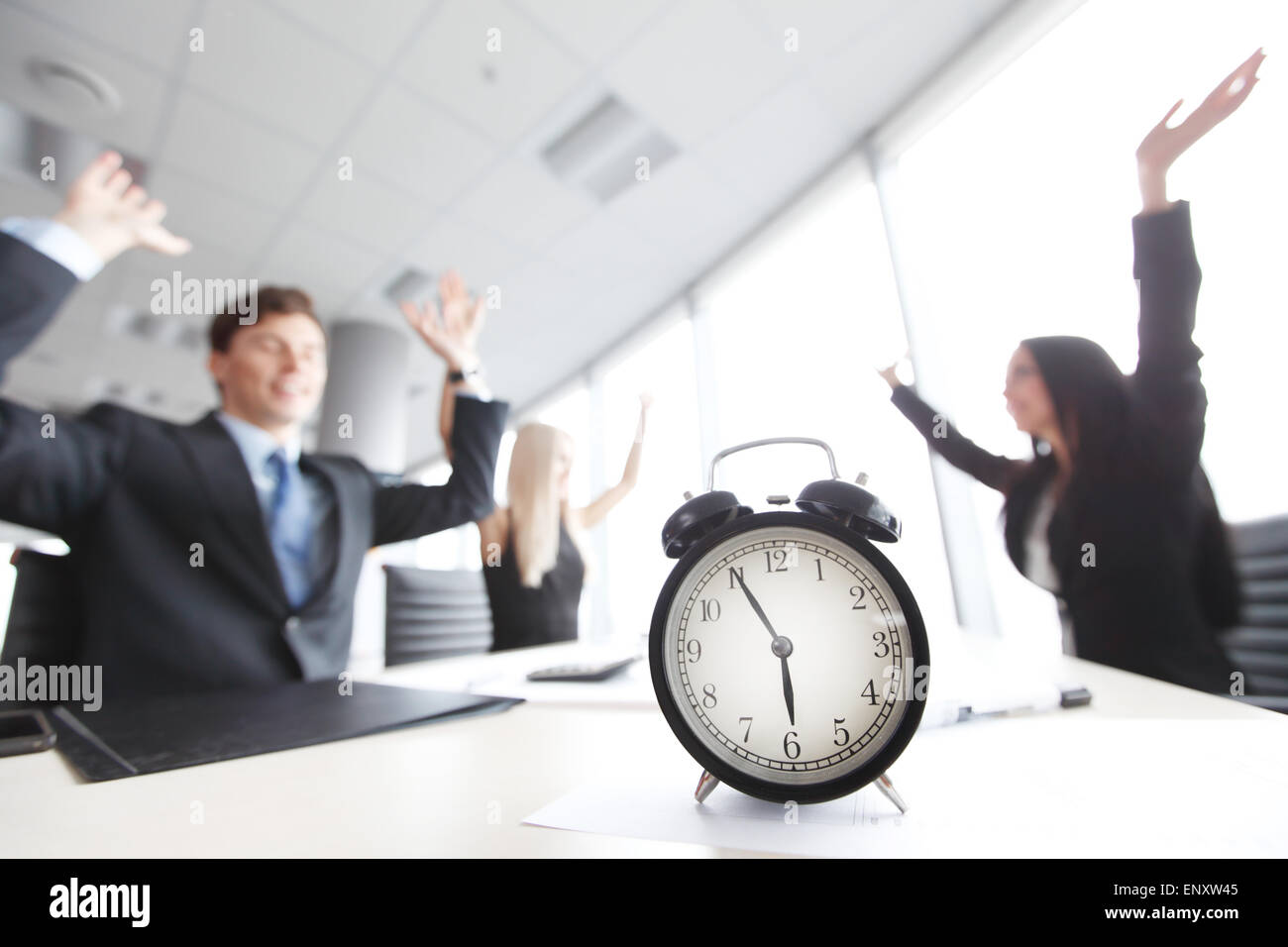 team rejoices at the end of workday Stock Photo