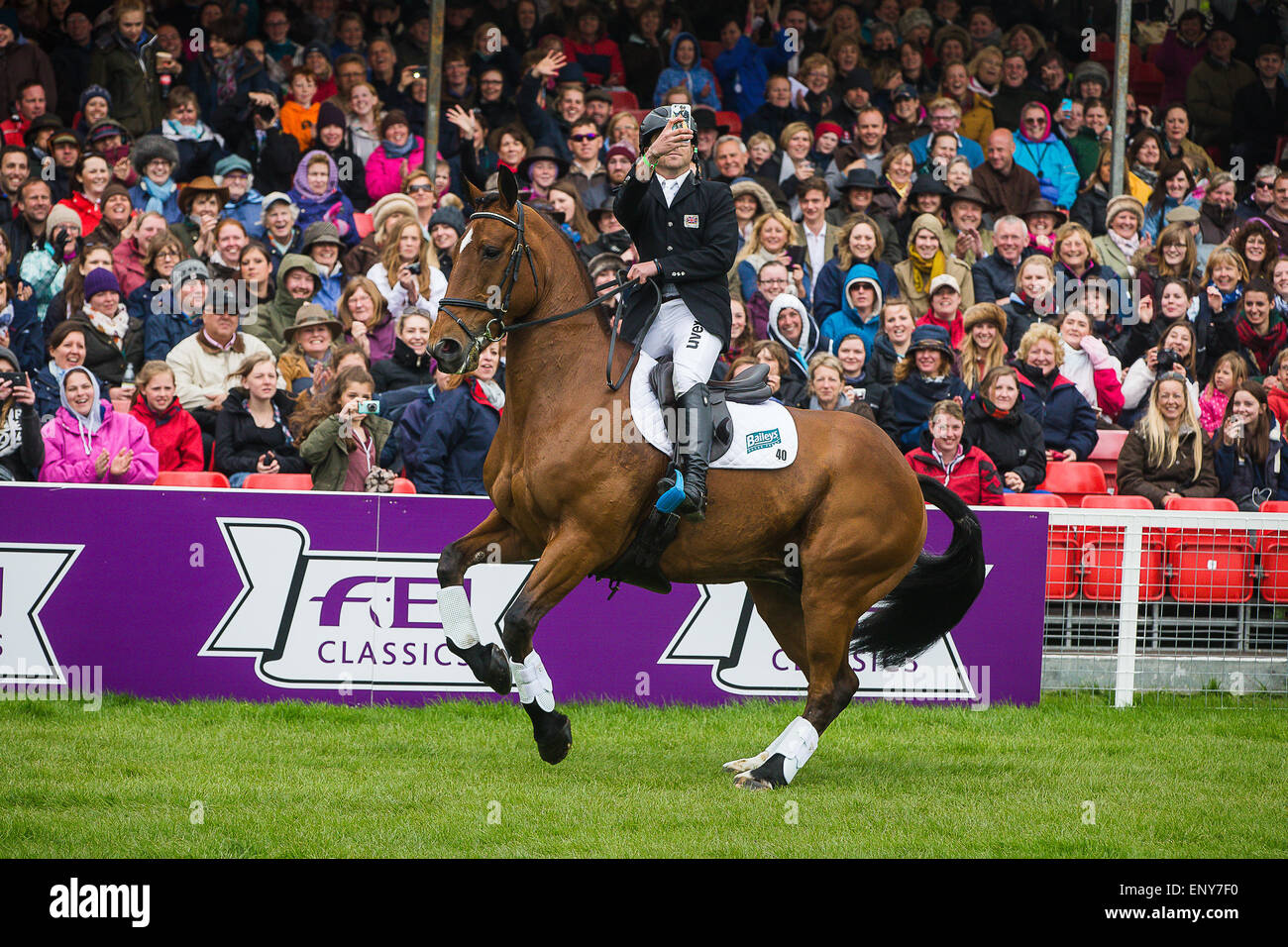 10th May, 2015. Ben Hobday takes a selfie during the parade of competitors at Badminton Horse Trials Credit:  David Betteridge/Alamy Live News Stock Photo