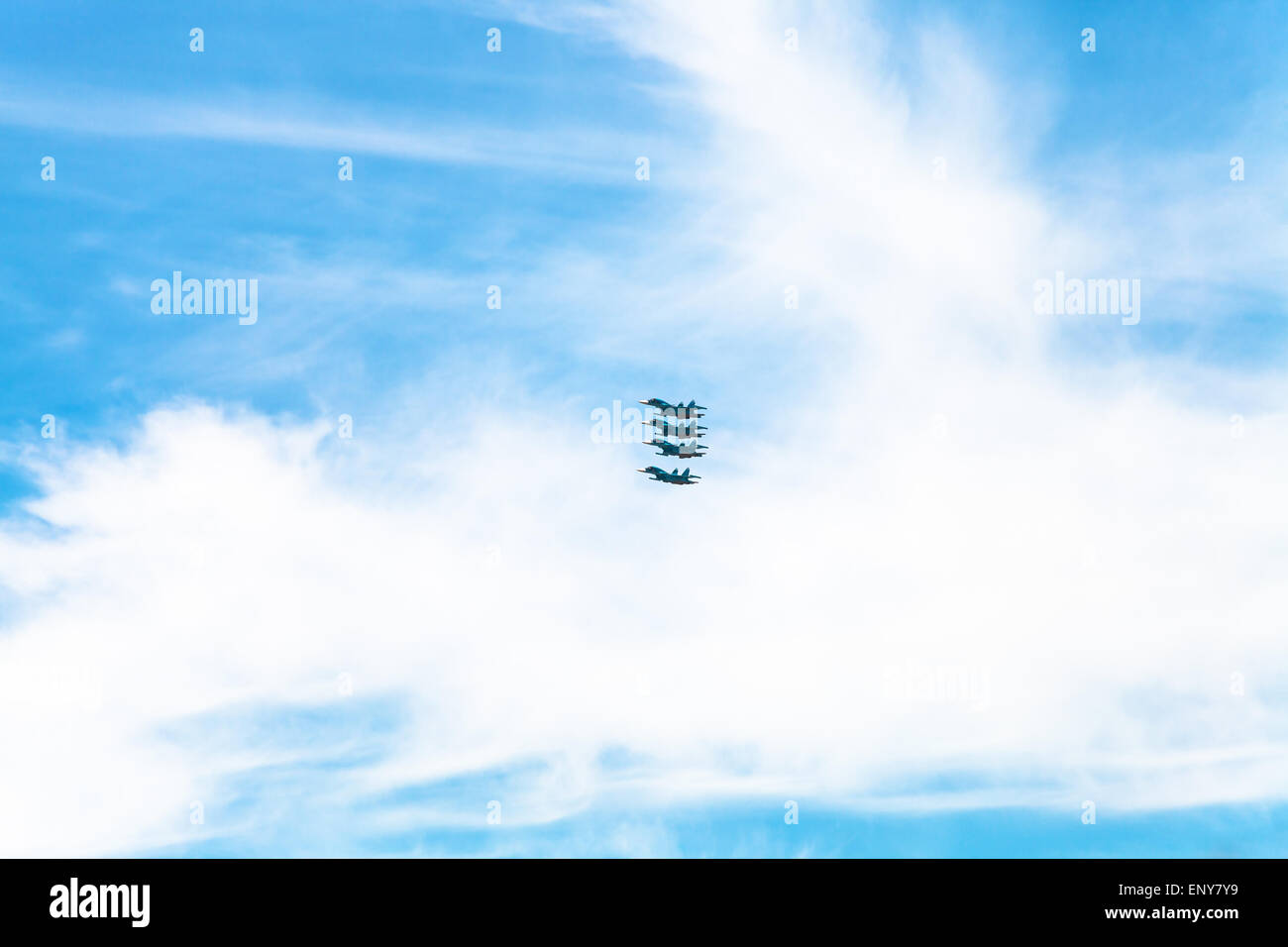 four military fighter aircrafts in white clouds in blue sky Stock Photo ...