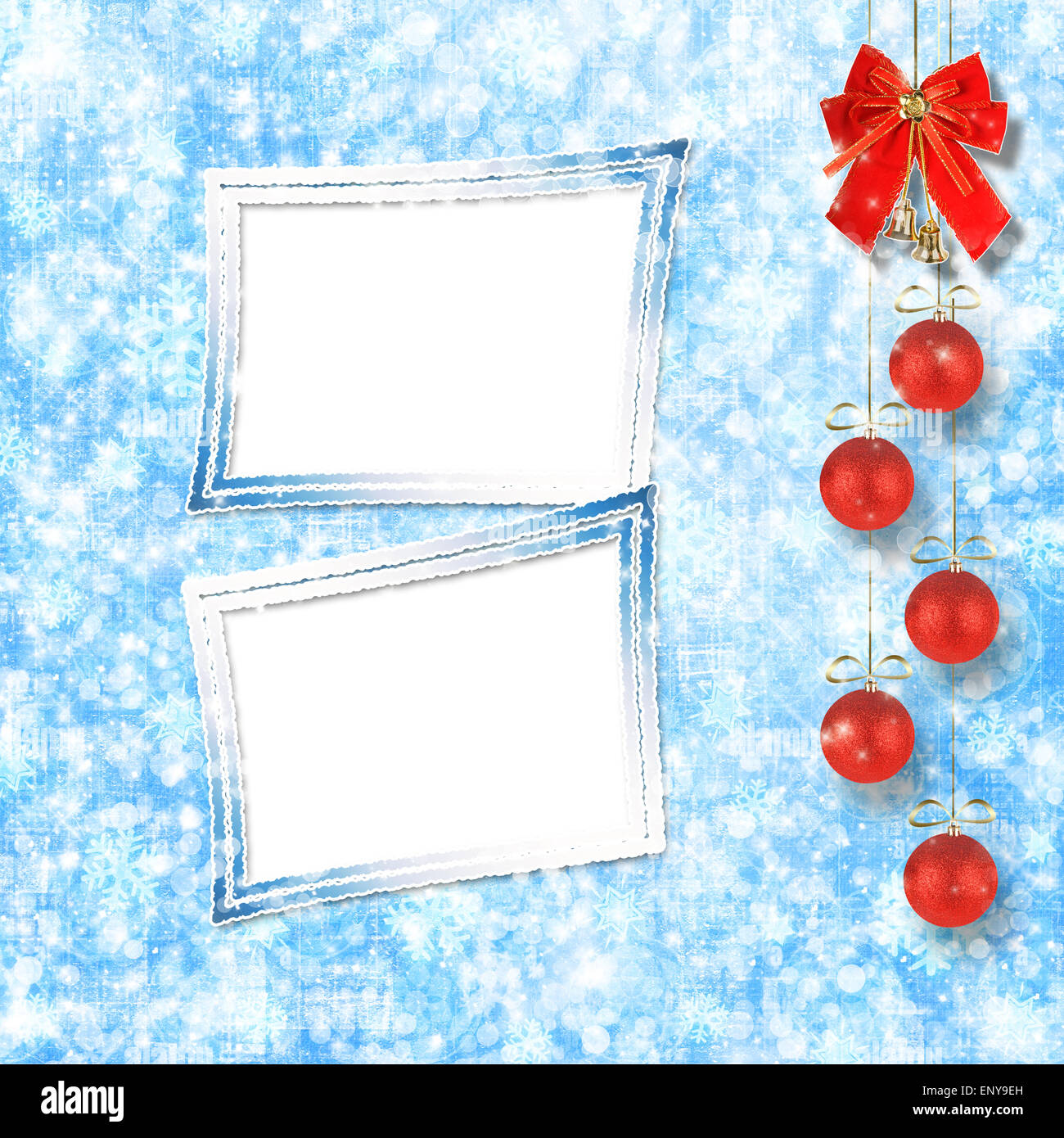 Christmas balls and red bow with bells on abstract snowy background Stock Photo