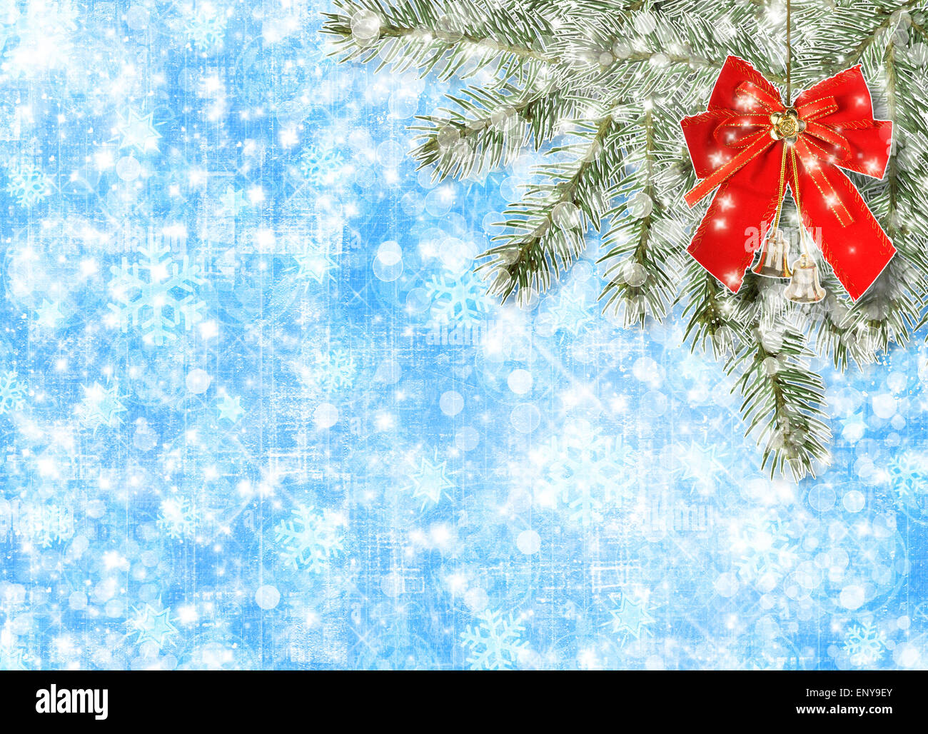 Christmas balls and red bow with bells on background snowy fir branches ...