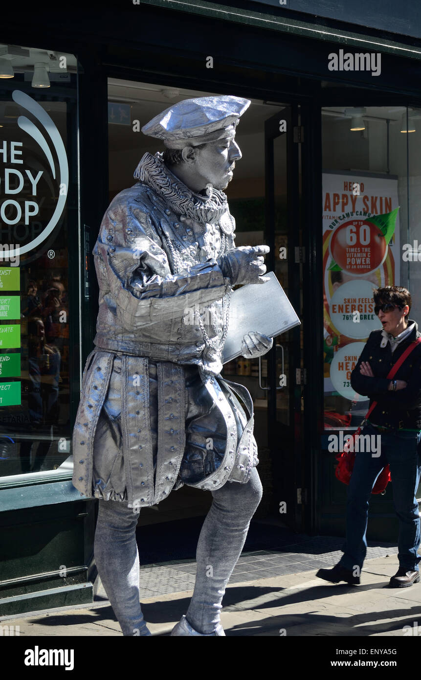 Silver painted street performer in hires stock photography and images