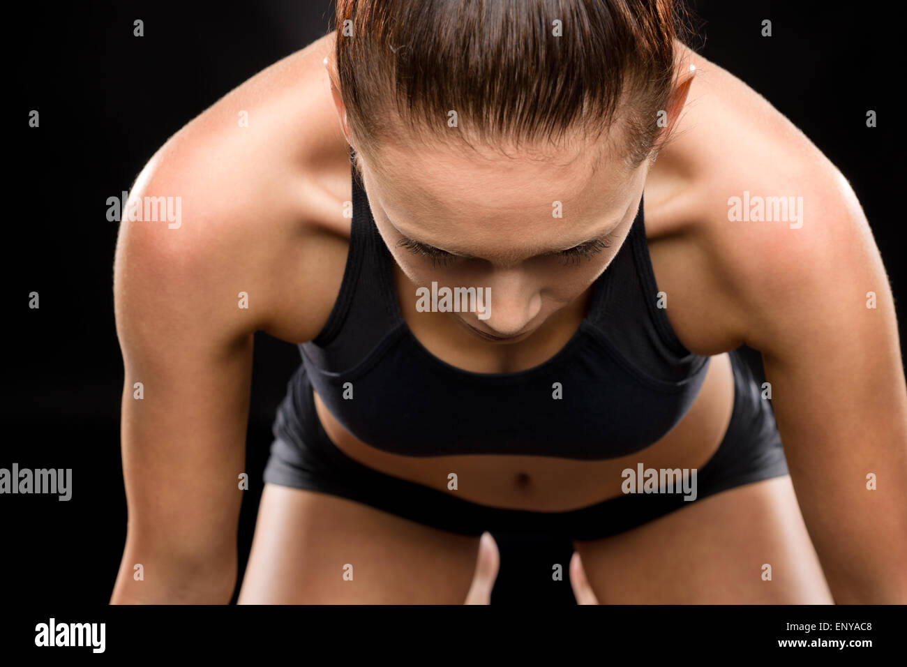 Pretty young woman doing stretching exercise pose Stock Photo