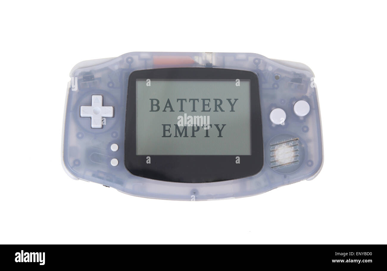 Old dirty portable game console with a small screen - battery empty Stock Photo