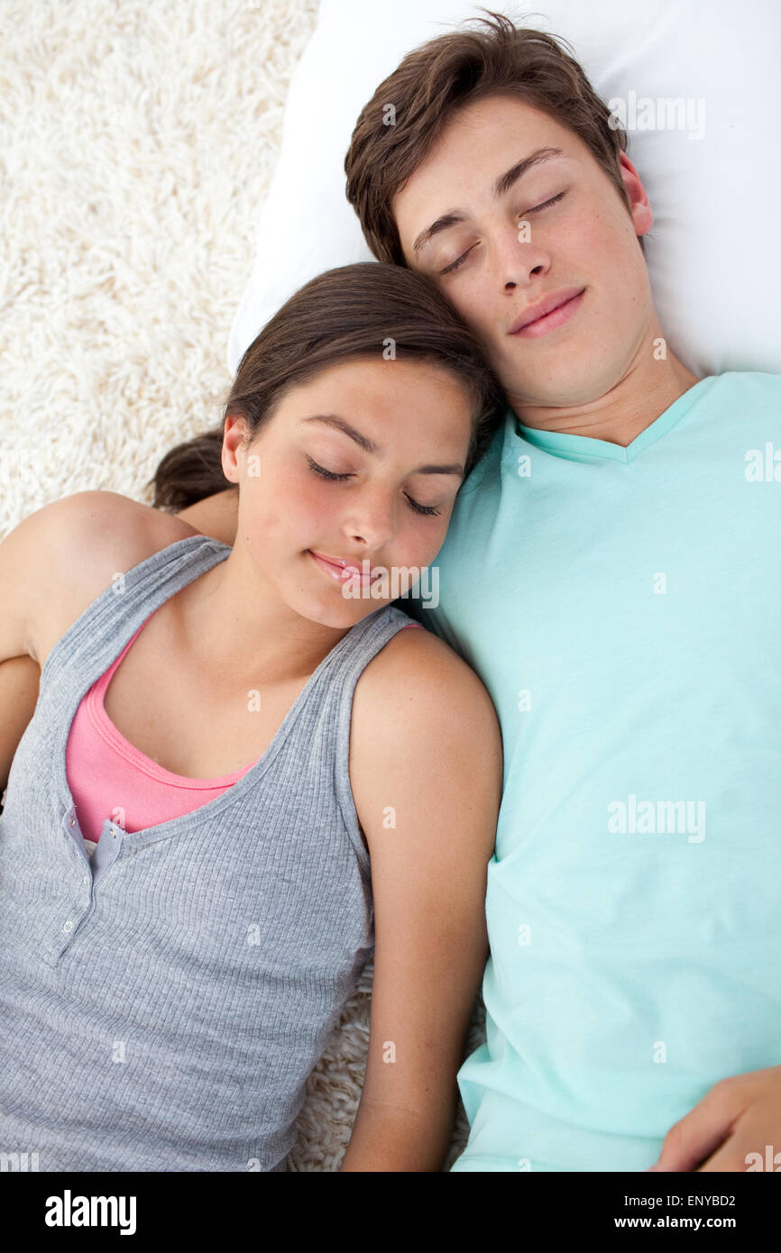 Teen lovers lying on the floor Stock Photo - Alamy