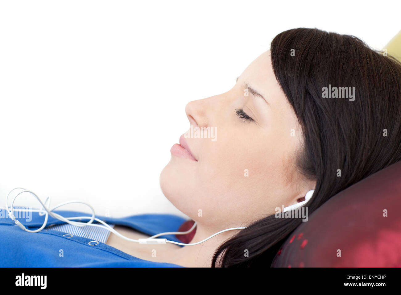 Relaxed teen girl listening music lying on a sofa Stock Photo - Alamy