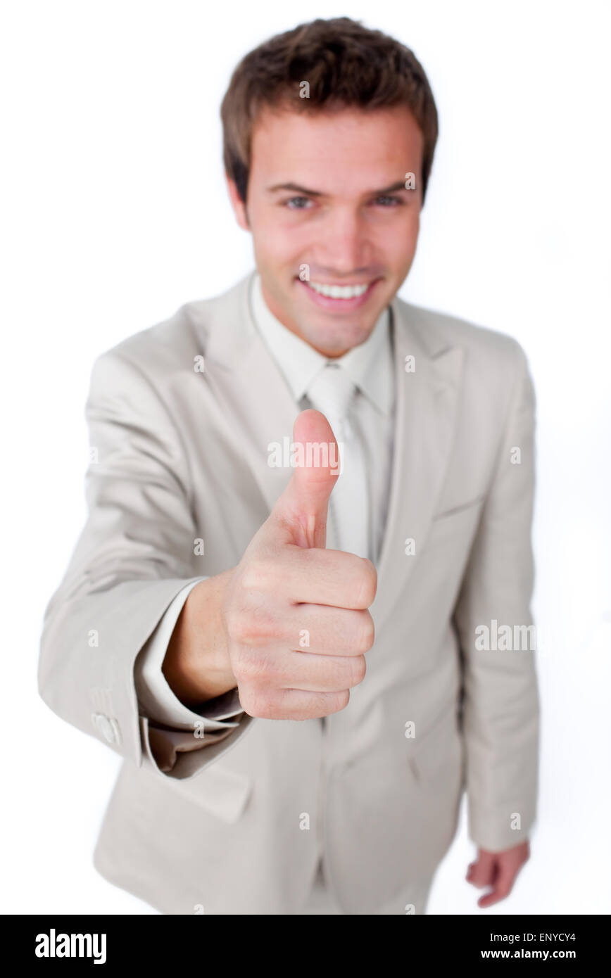 Successful businessman with thumb up against a white background Stock ...