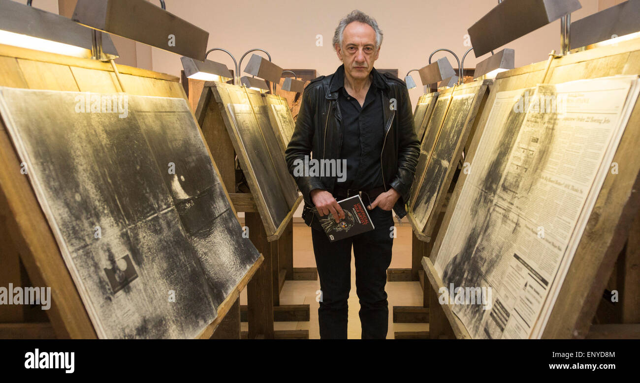 London, UK. 12 May 2015. Pictured: artist Peter Kennard (born 1949). Press preview of the exhibition 'Peter Kennard: Unofficial War Artist' at the Imperial War Museum in London, UK. The exhibition opens on 14 May 2015 and runs until 30 May 2016. This free exhibition at IWM London will be the first major retrospective of Kennard's work charting a 50 year career featuring over 200 artworks and related items, including a new art installation ‘Boardroom’ created especially for the exhibition. Political artist Peter Kennard has inpired artists from Mark Wallinger to Banksy. Stock Photo