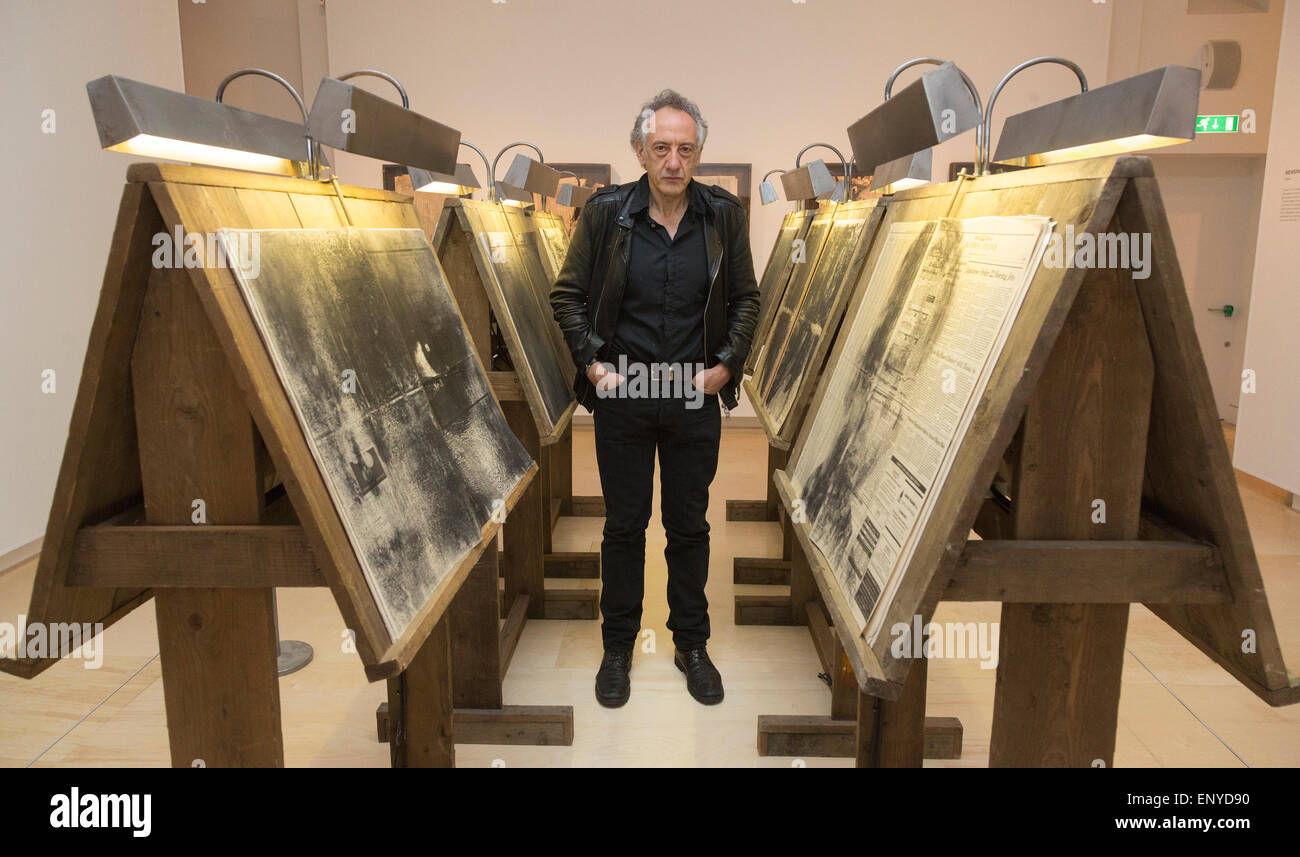 London, UK. 12 May 2015. Pictured: artist Peter Kennard (born 1949). Press preview of the exhibition 'Peter Kennard: Unofficial War Artist' at the Imperial War Museum in London, UK. The exhibition opens on 14 May 2015 and runs until 30 May 2016. This free exhibition at IWM London will be the first major retrospective of Kennard's work charting a 50 year career featuring over 200 artworks and related items, including a new art installation ‘Boardroom’ created especially for the exhibition. Political artist Peter Kennard has inpired artists from Mark Wallinger to Banksy. Stock Photo