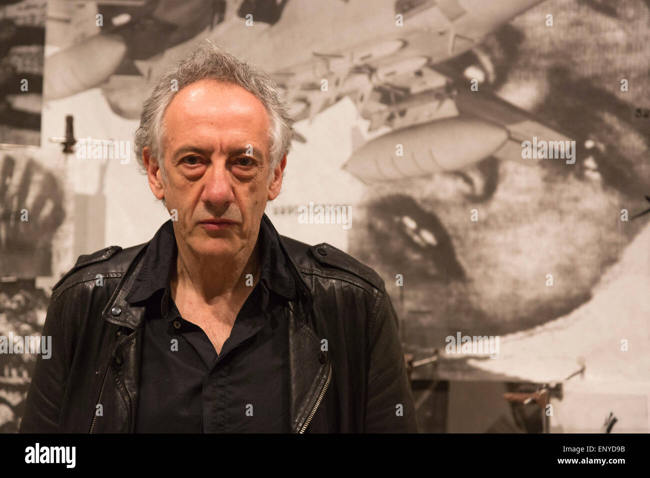 London, UK. 12 May 2015. Pictured: artist Peter Kennard (born 1949). Press preview of the exhibition 'Peter Kennard: Unofficial War Artist' at the Imperial War Museum in London, UK. The exhibition opens on 14 May 2015 and runs until 30 May 2016. This free exhibition at IWM London will be the first major retrospective of Kennard's work charting a 50 year career featuring over 200 artworks and related items, including a new art installation ‘Boardroom’ created especially for the exhibition. Political artist Peter Kennard has inpired artists from Mark Wallinger to Banksy. Stock Photo