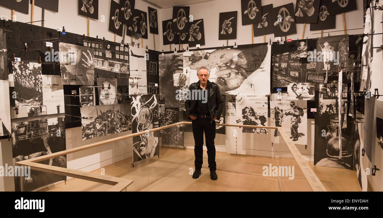London, UK. 12 May 2015. Pictured: artist Peter Kennard (born 1949). Press preview of the exhibition 'Peter Kennard: Unofficial War Artist' at the Imperial War Museum in London, UK. The exhibition opens on 14 May 2015 and runs until 30 May 2016. This free exhibition at IWM London will be the first major retrospective of Kennard's work charting a 50 year career featuring over 200 artworks and related items, including a new art installation ‘Boardroom’ created especially for the exhibition. Political artist Peter Kennard has inpired artists from Mark Wallinger to Banksy. Stock Photo
