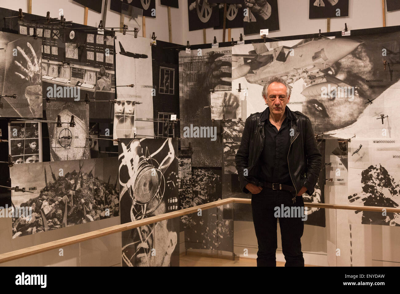 London, UK. 12 May 2015. Pictured: artist Peter Kennard (born 1949). Press preview of the exhibition 'Peter Kennard: Unofficial War Artist' at the Imperial War Museum in London, UK. The exhibition opens on 14 May 2015 and runs until 30 May 2016. This free exhibition at IWM London will be the first major retrospective of Kennard's work charting a 50 year career featuring over 200 artworks and related items, including a new art installation ‘Boardroom’ created especially for the exhibition. Political artist Peter Kennard has inpired artists from Mark Wallinger to Banksy. Stock Photo