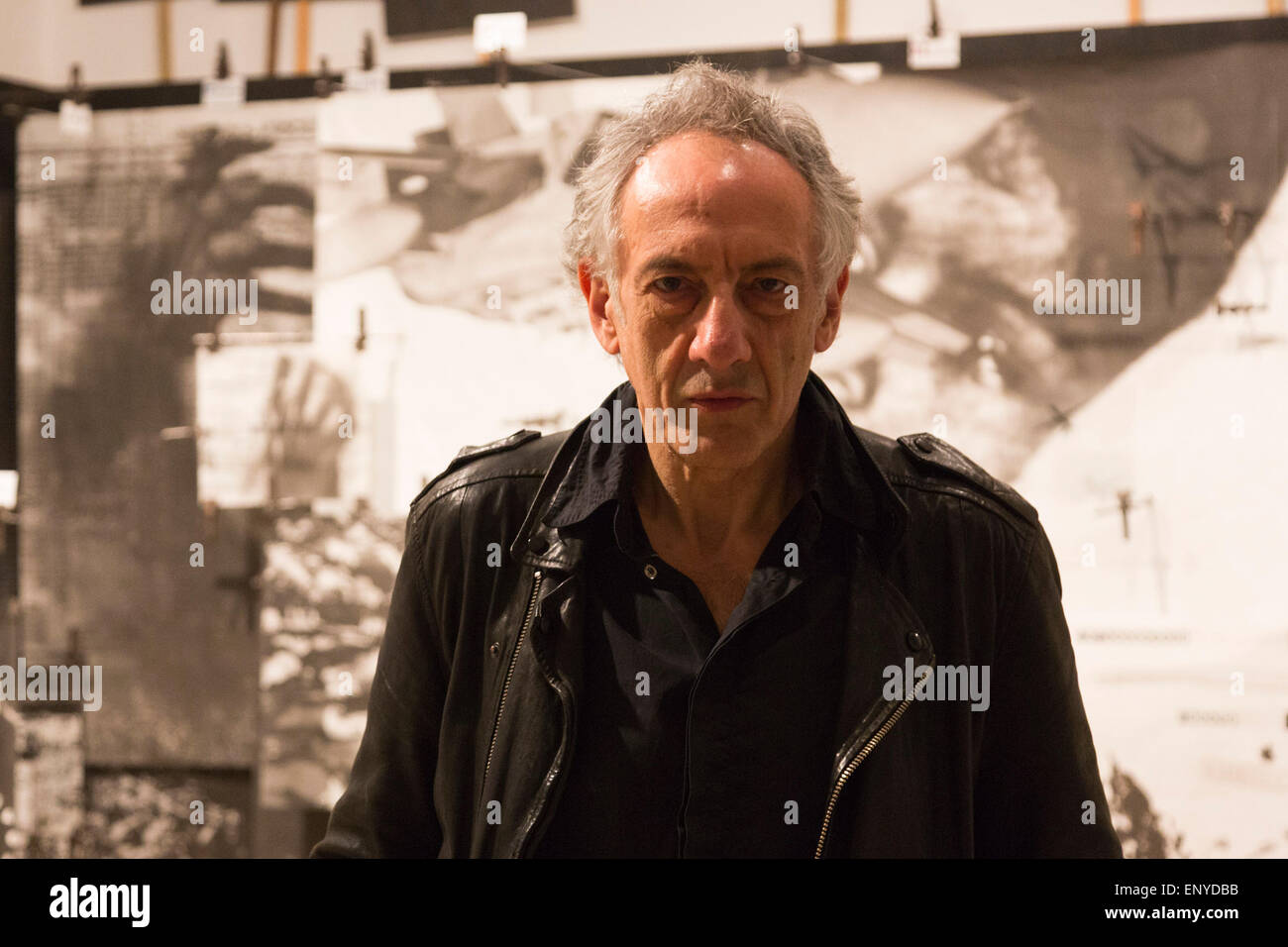 London, UK. 12 May 2015. Pictured: artist Peter Kennard (born 1949). Press preview of the exhibition 'Peter Kennard: Unofficial War Artist' at the Imperial War Museum in London, UK. The exhibition opens on 14 May 2015 and runs until 30 May 2016. This free exhibition at IWM London will be the first major retrospective of Kennard's work charting a 50 year career featuring over 200 artworks and related items, including a new art installation ‘Boardroom’ created especially for the exhibition. Political artist Peter Kennard has inpired artists from Mark Wallinger to Banksy. Stock Photo