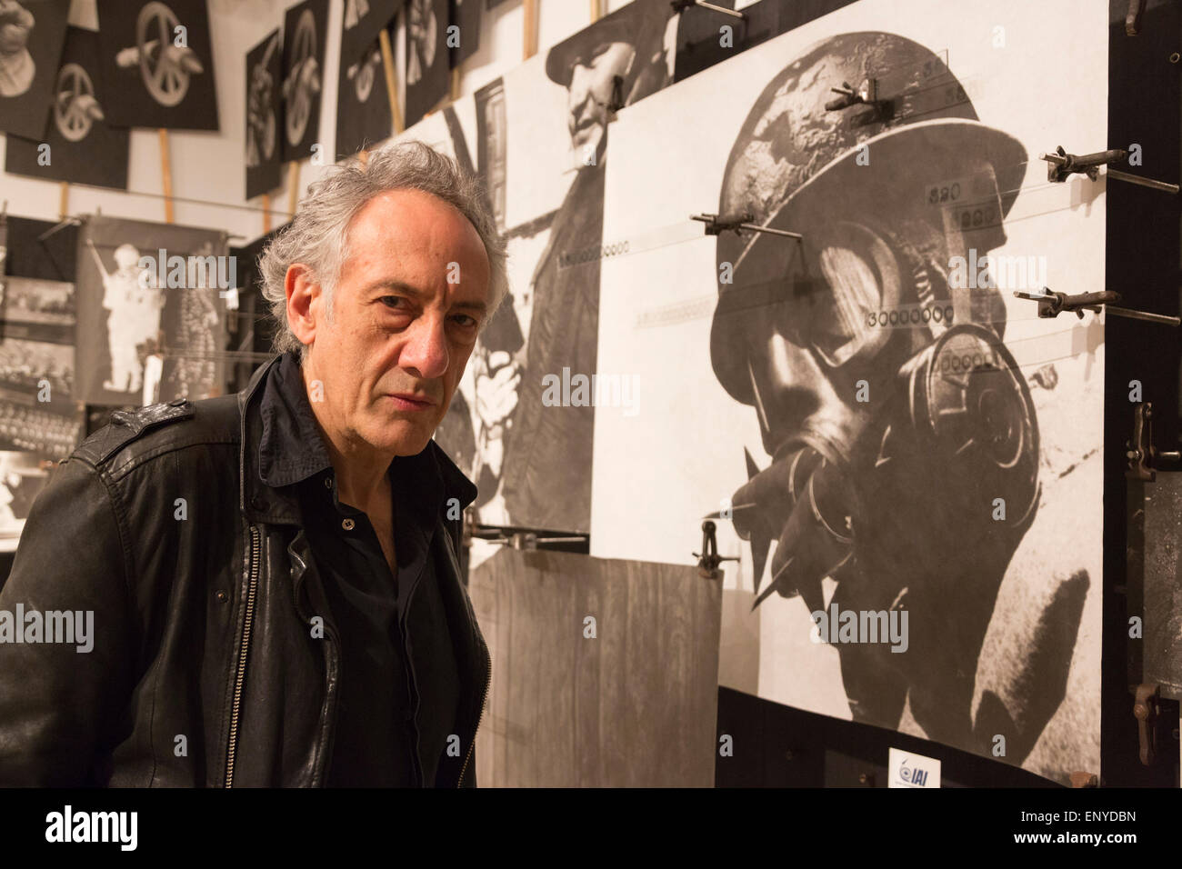 London, UK. 12 May 2015. Pictured: artist Peter Kennard (born 1949). Press preview of the exhibition 'Peter Kennard: Unofficial War Artist' at the Imperial War Museum in London, UK. The exhibition opens on 14 May 2015 and runs until 30 May 2016. This free exhibition at IWM London will be the first major retrospective of Kennard's work charting a 50 year career featuring over 200 artworks and related items, including a new art installation ‘Boardroom’ created especially for the exhibition. Political artist Peter Kennard has inpired artists from Mark Wallinger to Banksy. Stock Photo