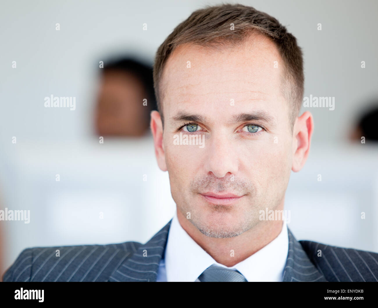 Handsome businessman looking at the camera Stock Photo - Alamy