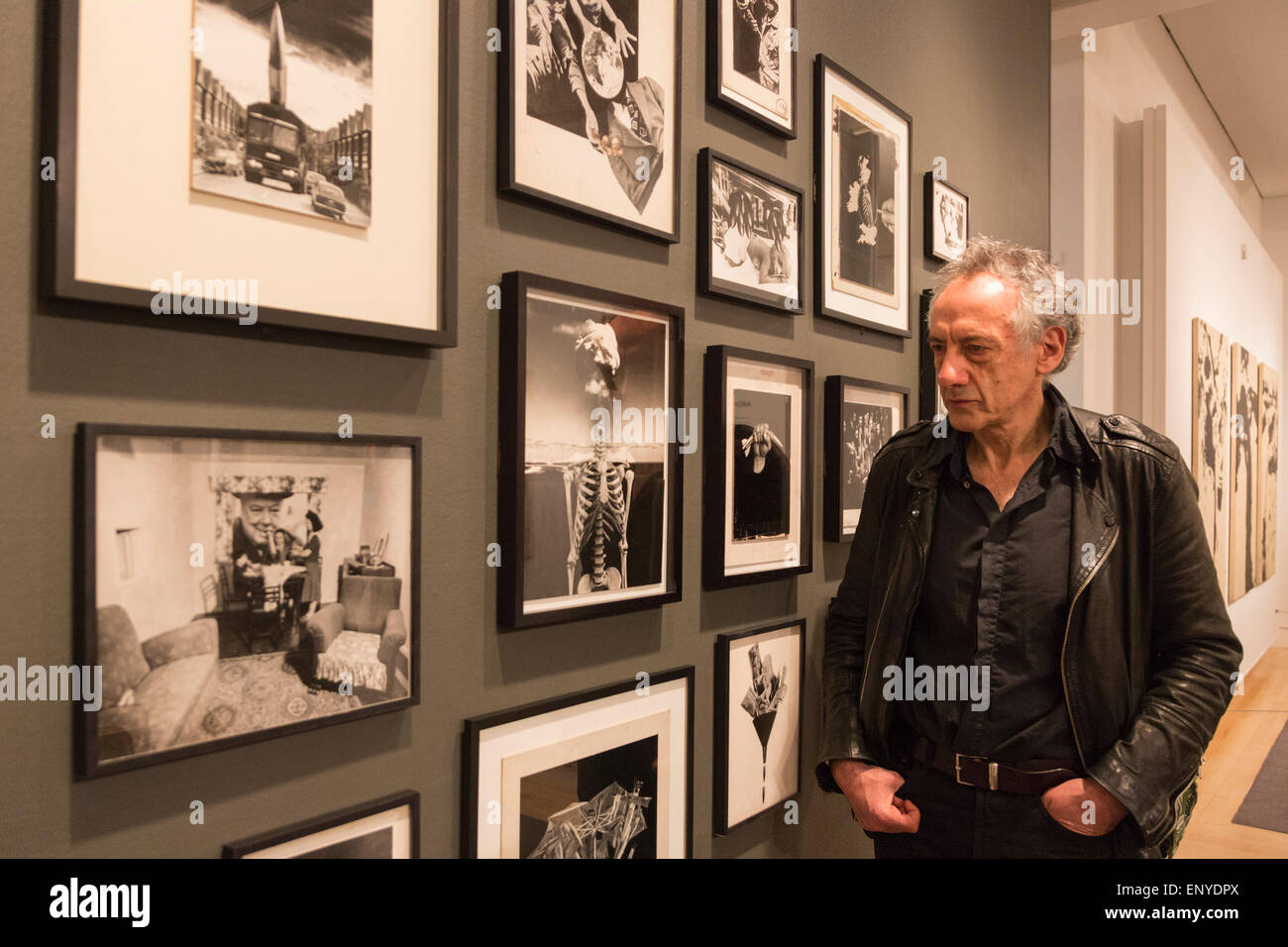 London, UK. 12 May 2015. Pictured: artist Peter Kennard (born 1949). Press preview of the exhibition 'Peter Kennard: Unofficial War Artist' at the Imperial War Museum in London, UK. The exhibition opens on 14 May 2015 and runs until 30 May 2016. This free exhibition at IWM London will be the first major retrospective of Kennard's work charting a 50 year career featuring over 200 artworks and related items, including a new art installation ‘Boardroom’ created especially for the exhibition. Political artist Peter Kennard has inpired artists from Mark Wallinger to Banksy. Stock Photo