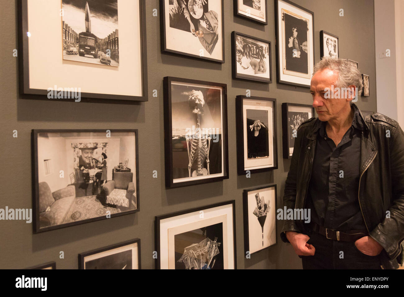 London, UK. 12 May 2015. Pictured: artist Peter Kennard (born 1949). Press preview of the exhibition 'Peter Kennard: Unofficial War Artist' at the Imperial War Museum in London, UK. The exhibition opens on 14 May 2015 and runs until 30 May 2016. This free exhibition at IWM London will be the first major retrospective of Kennard's work charting a 50 year career featuring over 200 artworks and related items, including a new art installation ‘Boardroom’ created especially for the exhibition. Political artist Peter Kennard has inpired artists from Mark Wallinger to Banksy. Stock Photo