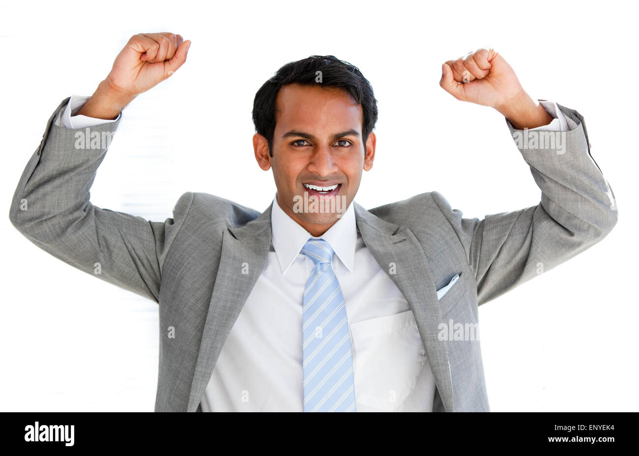Happy businessman punching the air in the office Stock Photo - Alamy