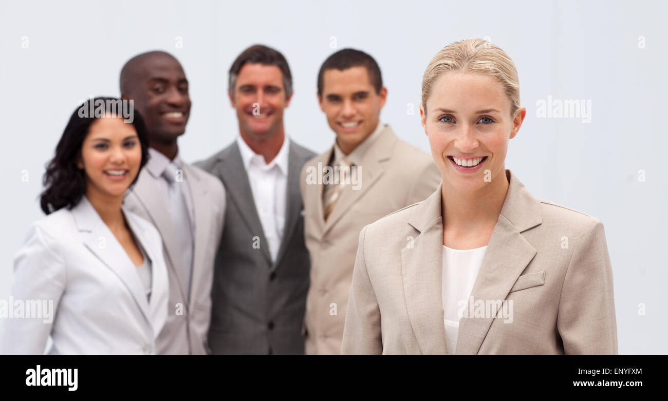 Smiling businesswoman leading her team Stock Photo - Alamy