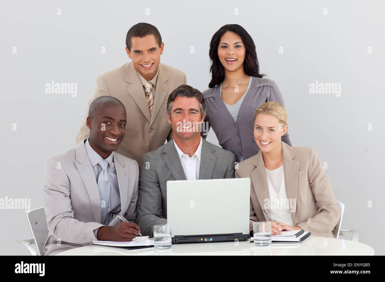 Happy multi-ethnic business team working in office together Stock Photo ...