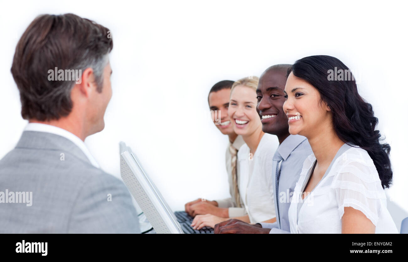 Mature manager talking to his team in the office Stock Photo - Alamy